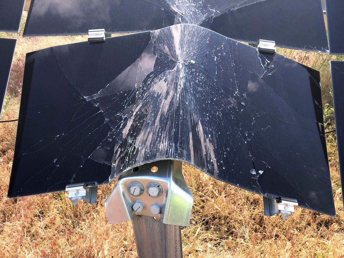 Close-up of a damaged GameChange Solar tracker support assembly on a ground-mounted solar array.